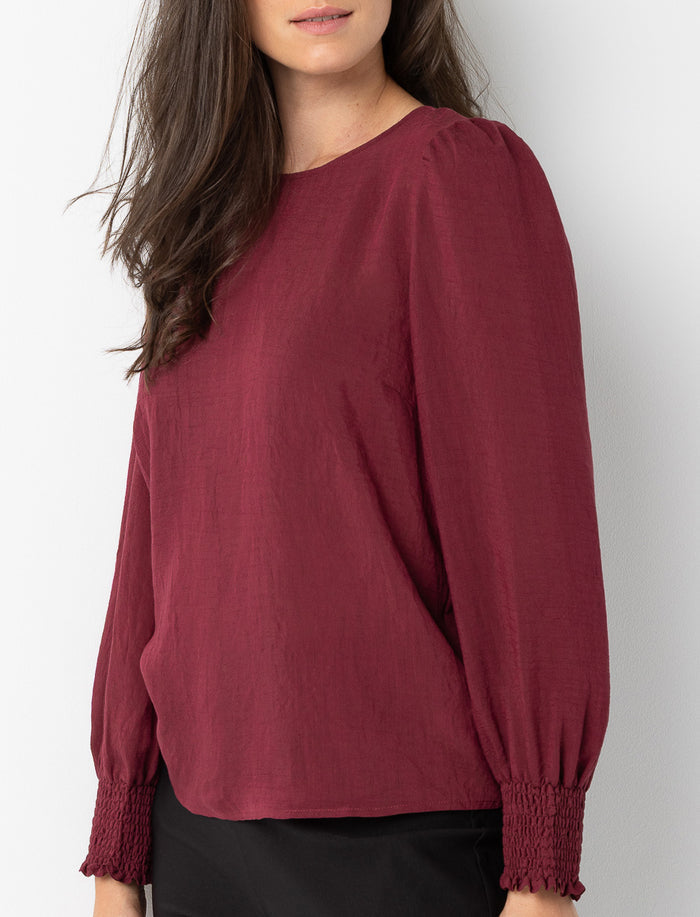 Blouse texturée à manches bouffantes