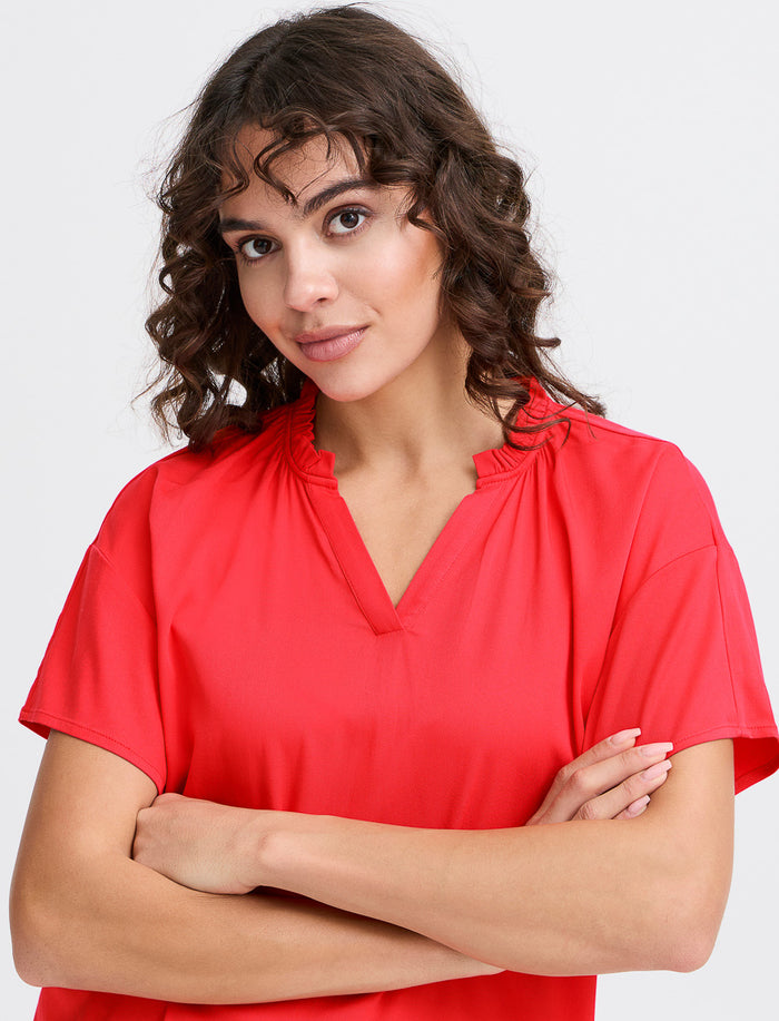 Blouse unie à col fendu
