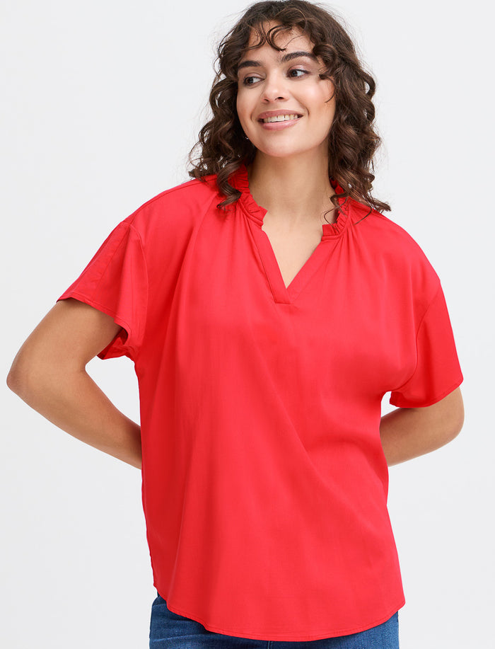 Blouse unie à col fendu