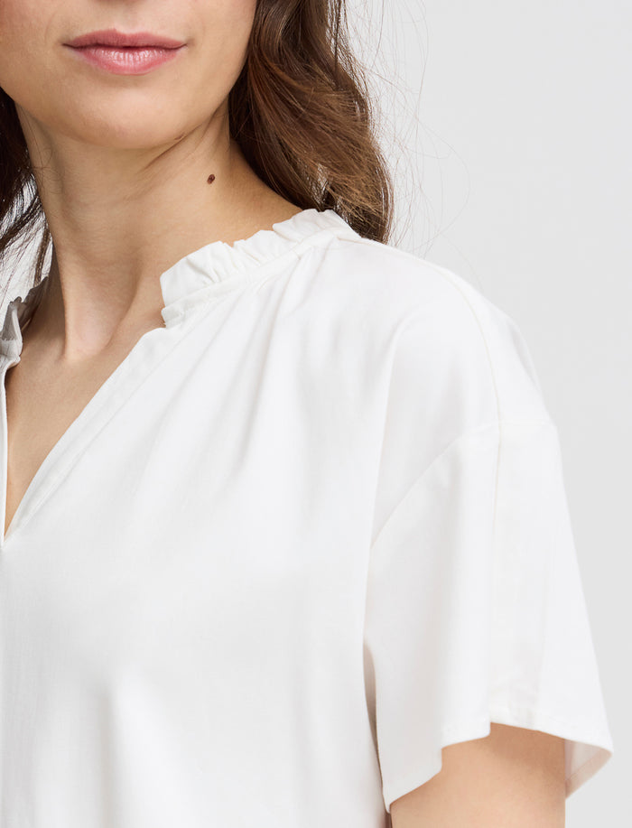 Blouse unie à col fendu