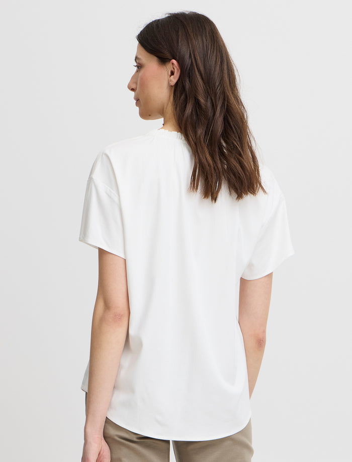 Blouse unie à col fendu