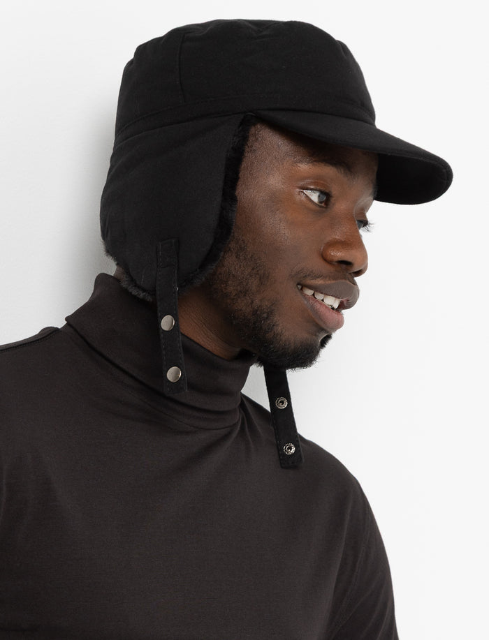 Casquette avec protège-oreilles et fausse fourrure