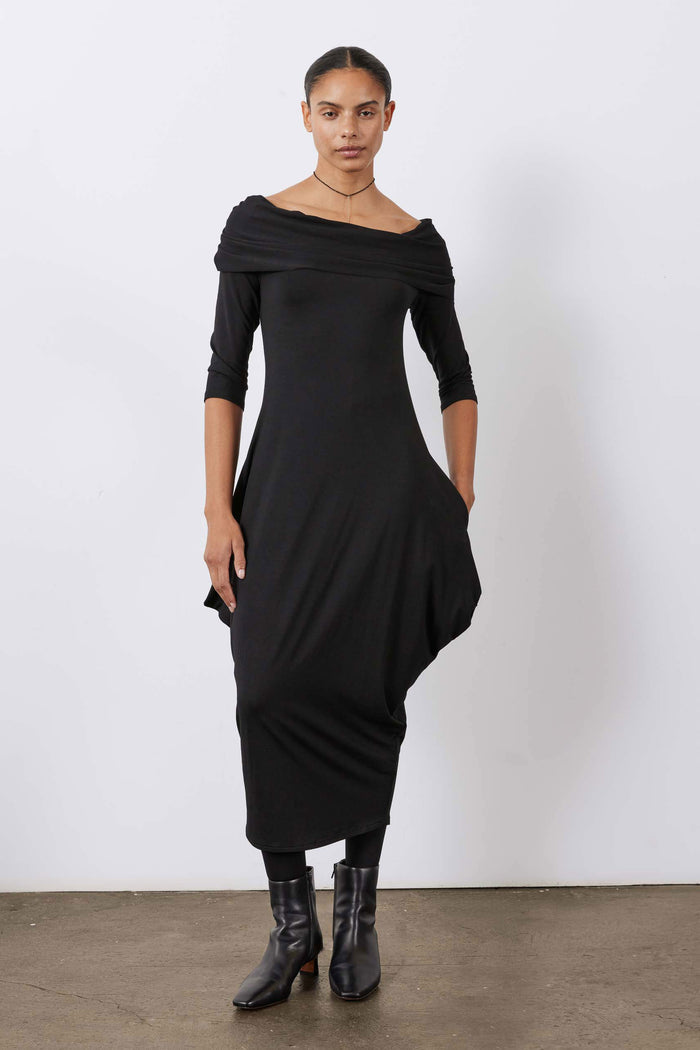 Black off-shoulder midi dress with draped neckline and 3/4 sleeves, front view.
