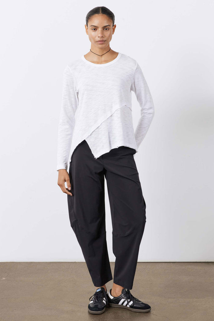 Black wide pants with elastic waist, side pockets, and tapered ankle
