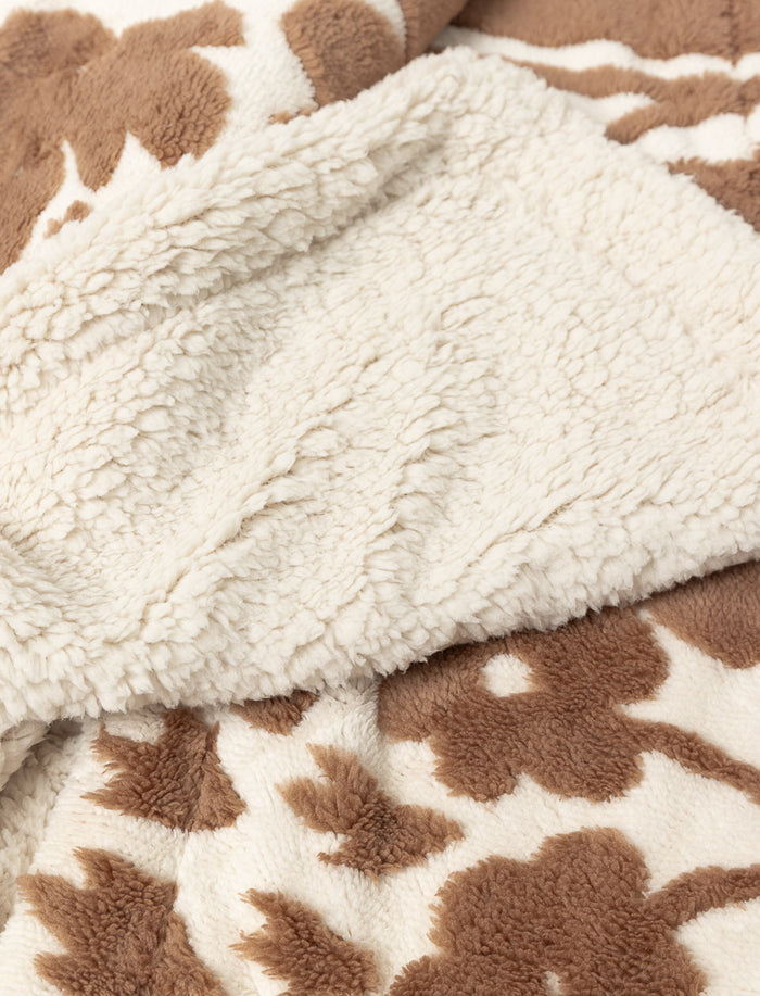 Jeté jacquard sherpa à motif feuillage