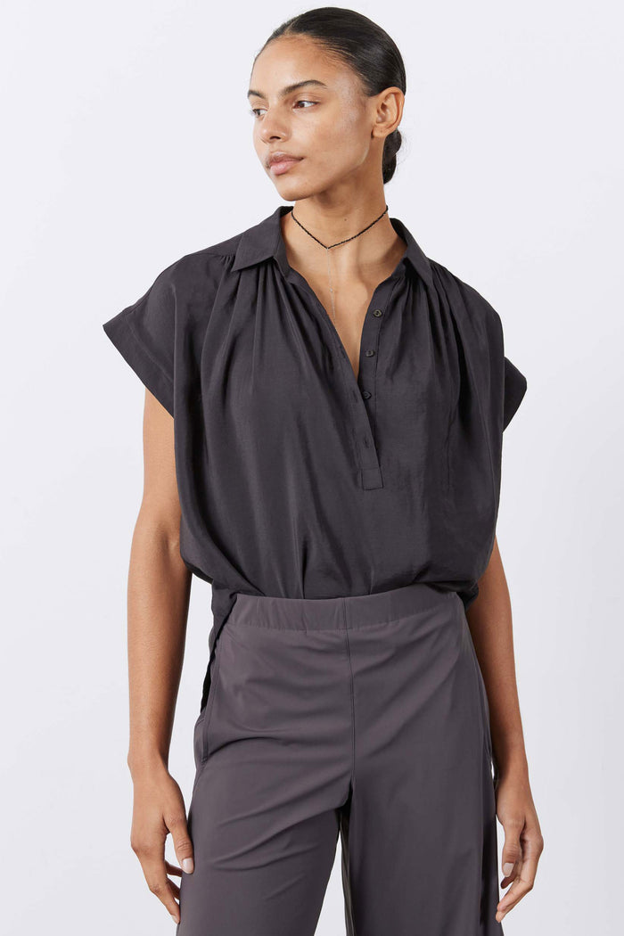 Black oversized voile blouse with gathered shoulders and short sleeves, front view