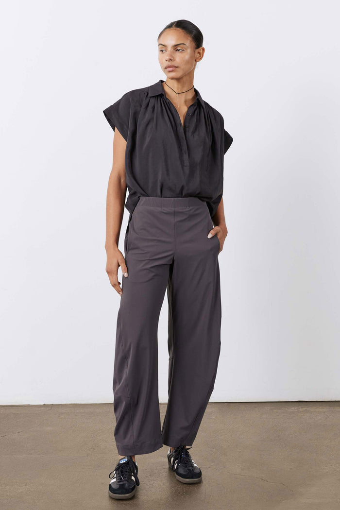 Black oversized voile blouse with short sleeves and button placket, front full-length view