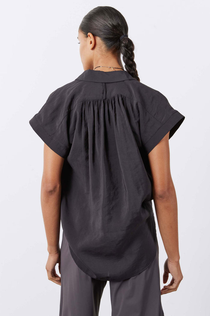 Black oversized voile blouse back view with gathered yoke and short sleeves