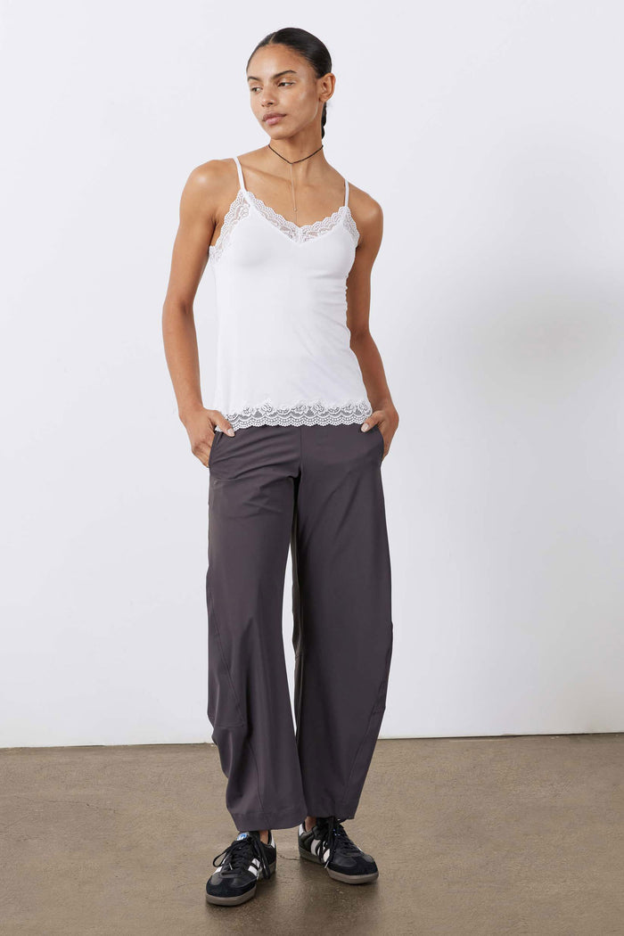 White lace-trim cami with thin straps and scalloped hem, full-body view